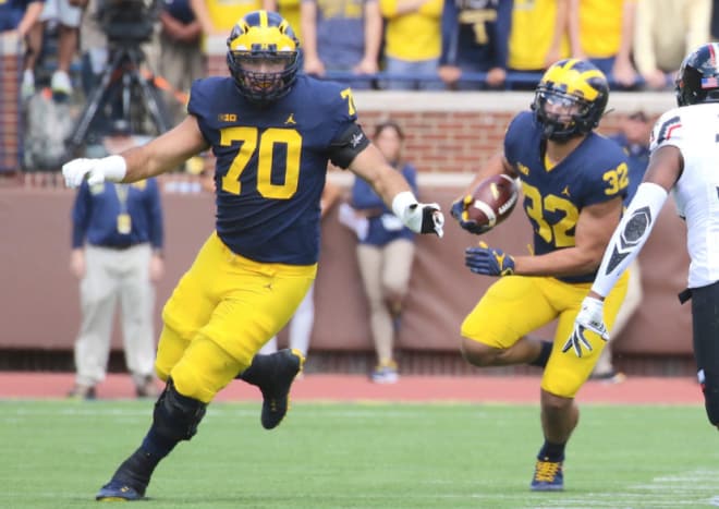 Michigan redshirt junior offensive tackle Nolan Ulizio will compete for the right tackle job.