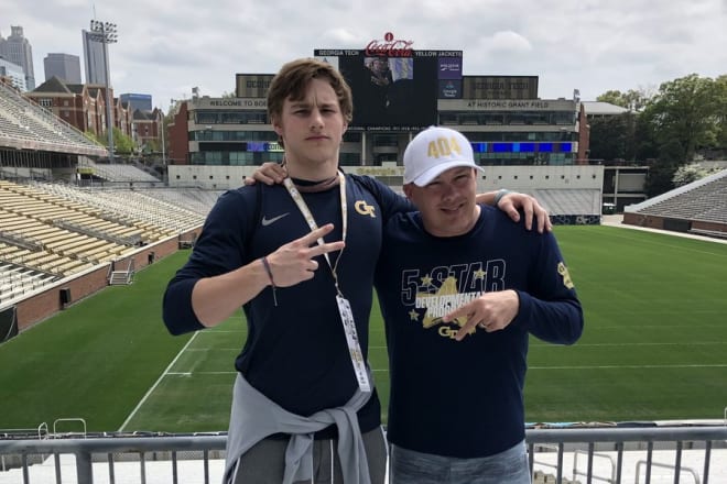 Behrens poses with Geoff Collins during his visit to Tech