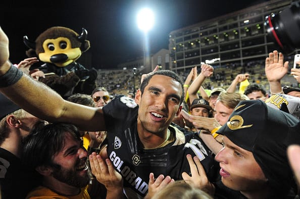 BOULDER, CO - OCTOBER 15: Colorado Buffaloes quarterback Sefo Liufau #13 celebrates with fans who had rushed the field after a 40-16 win over the Arizona State Sun Devils at Folsom Field on October 15, 2016 in Boulder, Colorado. (Photo by Dustin Bradford/Getty Images)