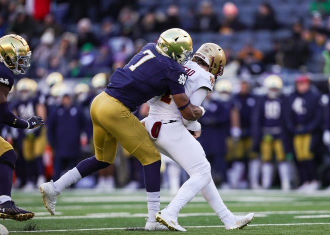 Notre Dame defensive end Isaiah Foskey sacks BC's Emmett Morehead, his school record-breaking 25th.