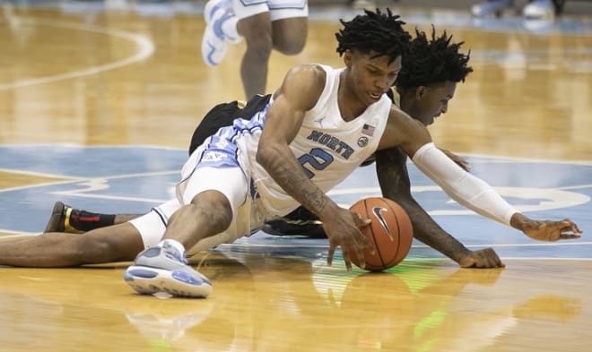 Caleb Love (2) and Day'Ron Sharpe had big nights in their first games ever as Carolina Tar Heels in Wednesday's win.