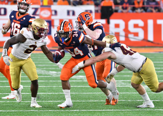 BC linebackers Bryce Steele (left) and Vinny DePalma (right) attempt to tackle Syracuse running back Sean Tucker last season (Photo: Mark Konezny-USA TODAY Sports).