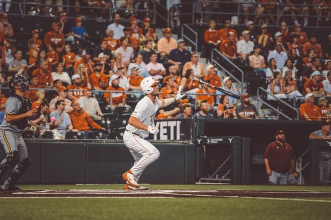 Zach Zubia watches his homer fly off the bat. (@TexasBaseball)