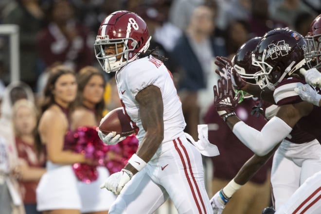 Alabama Crimson Tide receiver John Metchie III runs away from Mississippi State defenders. Photo | Getty Images 