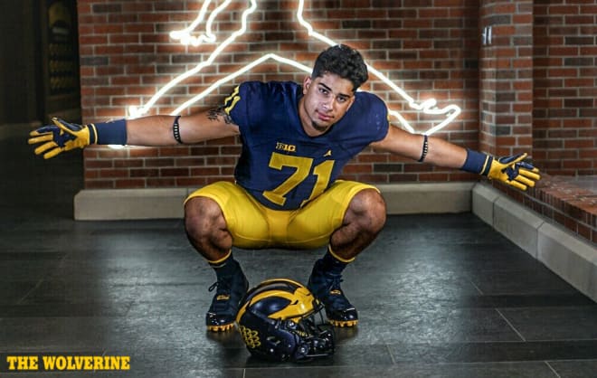 Three-star strongside defensive end Aaron Lewis flipped from West Virginia to Michigan while on campus for an official visit.
