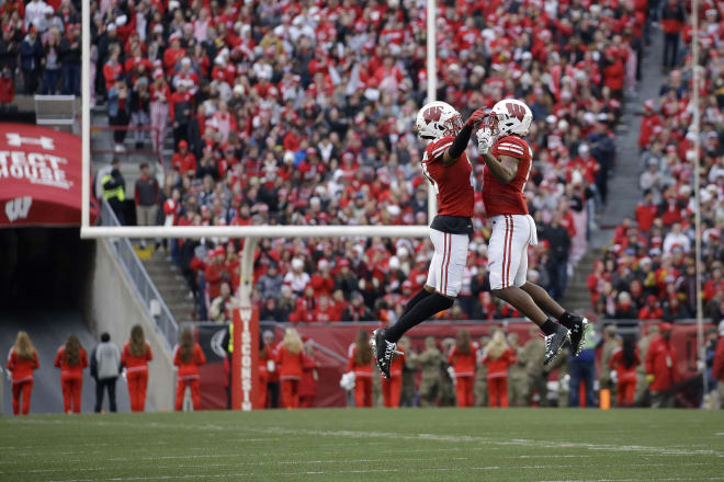 Wisconsin's Caesar Williams and Rachad Wildgoose celebrate a defensive turnover during Wisconsin's win at Iowa last season at Camp Randall Stadium.
