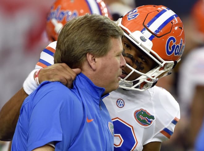 Former Florida quarterback Josh Grady embraces UF head coach Jim McElwain