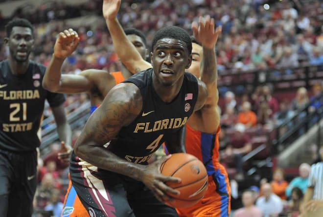 Sophomore Dwayne Bacon works to make a play inside the UF defense on Sunday.