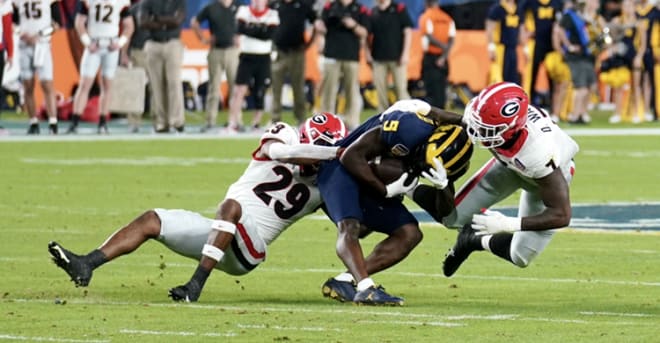 Georgia safety Christopher Smith (29) and linebacker Quay Walker (7) during Georgia's 34-11 win over Michigan in the Orange Bowl at Hard Rock Stadium in Miami, Florida, on Dec. 31, 2021. Photo by Blayne Gilmer.