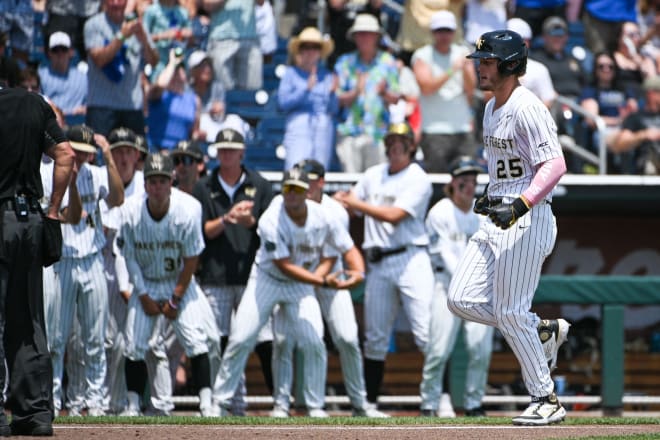 Brock Wilken, right, rounds the bases after hitting a home run in Wake's first game of the Men's College World Series. 