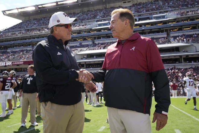 Jimbo Fisher (left) with Nick Saban