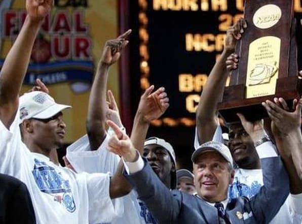 Hooker (behind Roy Williams' right arm) celebrates after winning the 2005 NCAA title.