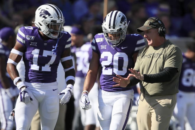 Jonathan Alexander and Denzel Goolsby display the white helmets and pants in 2019