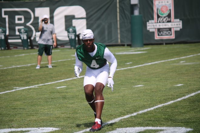 Jermaine Foster works out at defensive back on Thursday as one of dozens of Cleveland Glenville players at Michigan State's half-day camp. 