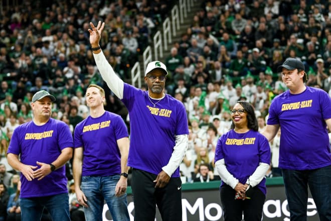 Former Michigan State coach Mike Garland, center, thanks a group of people - who helped saved his life when his heart stopped while driving in August - during the first half of the Spartans game against Maryland on Tuesday, Feb. 7, 2023, at the Breslin Center in East Lansing. Photo credit: Nick King/Lansing State Journal/USA TODAY NETWORK