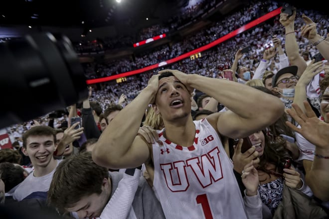 Johnny Davis looks to the rafters as he's surrounded by students following Wisconsin's 70-67 win over Purdue.