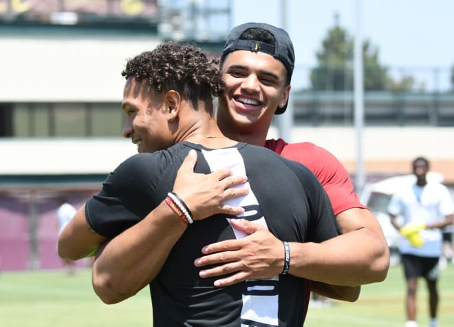 Freshman WR Kyle Ford embraces freshman CB Chris Steele, who joins the Trojans after going through spring ball at Florida. (Nick Lucero/Rivals)
