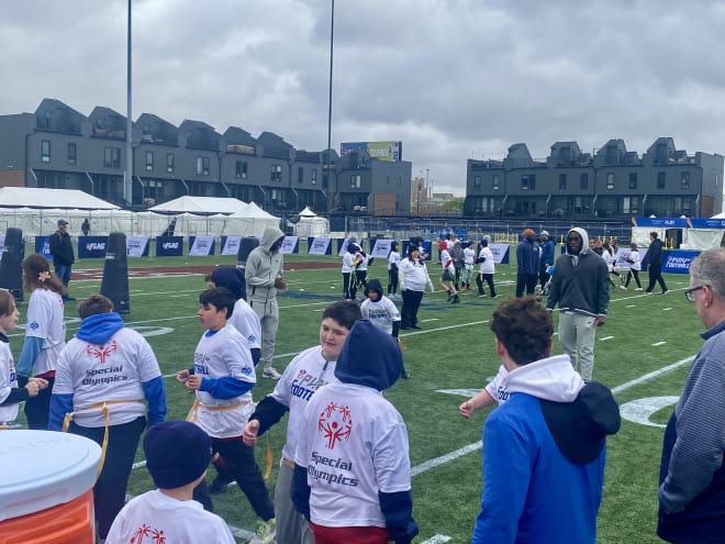 Robinson leads Special Olympians through drills at the Play Football Prospect Clinic in Detroit.