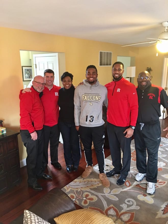 RU Coaches Kill, Ash and Williams pose with the Wormley family