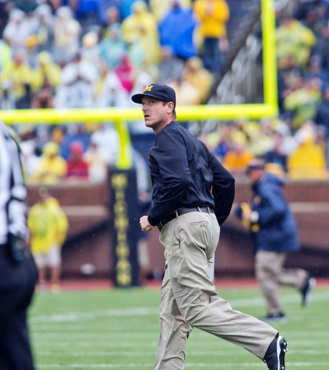 Jim Harbaugh hopes a peek at the scoreboard will bring smiles rather than winces in 2021.