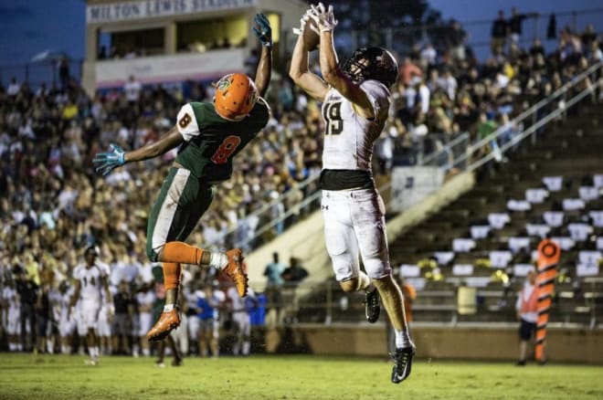Trent Whittemore (right) hauls in a touchdown pass against Eastside in 2018. 
