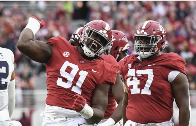 Alabama Crimson Tide defensive lineman Jaheim Oatis (91) celebrates after tackling Auburn Tigers quarterback Robby Ashford (9) at Bryant-Denny Stadium. Photo | Gary Cosby Jr.-USA TODAY Sports