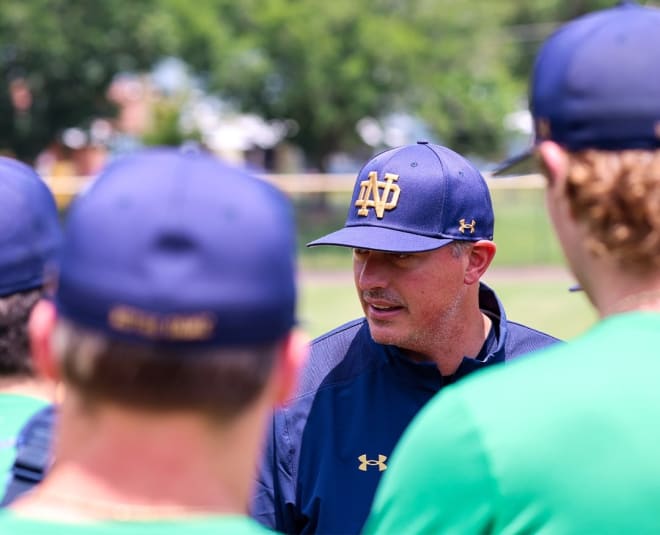 Notre Dame coach Shawn Stiffler (center) talks to his Irish baseball team during a workout Tuesday in Durham, N.C.