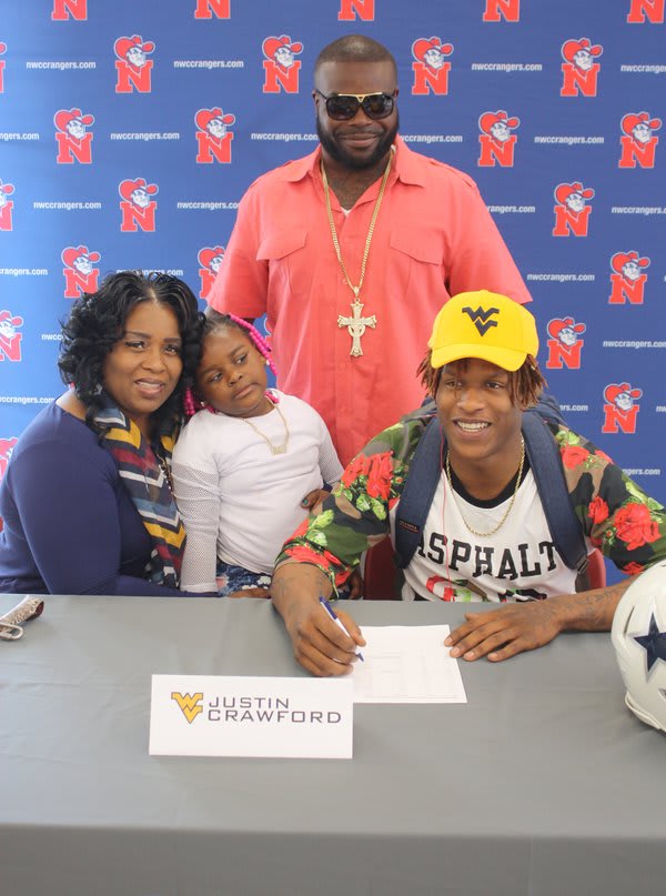 Crawford signed with West Virginia Wednesday. 
