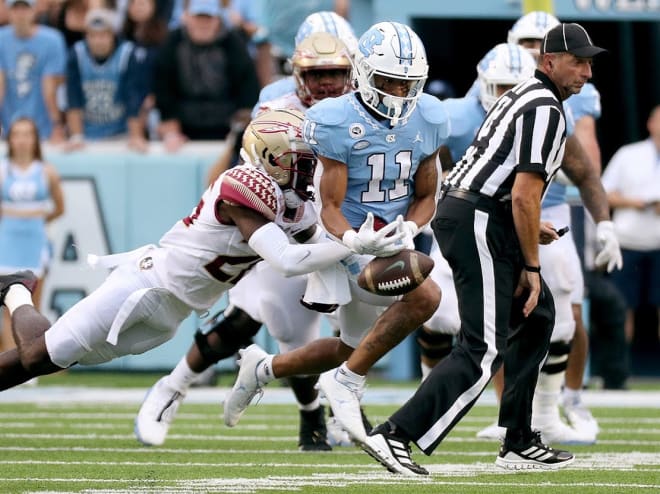 FSU freshman Kevin Knowles breaks up a pass to North Carolina star receiver Josh Downs on Saturday.