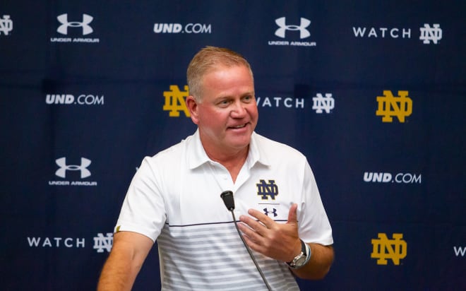 Brian Kelly speaking to the media at a press conference (Photo: Mike Miller)