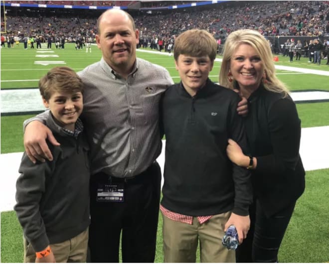 Tia and Barry with their sons at the Cotton Bowl in 2014.