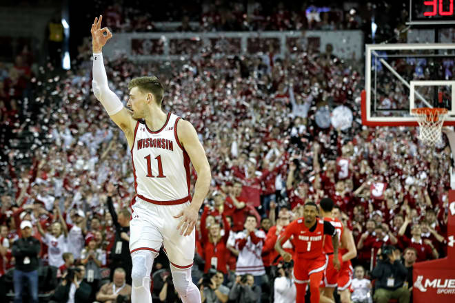 Micah Potter celebrates his 3-pointer that began the game for Wisconsin