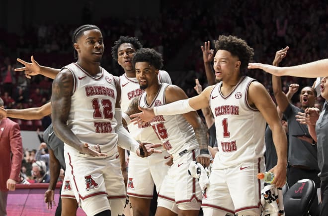Alabama Crimson Tide guard Latrell Wrightsell Jr. (12) celebrates with the  Alabama bench after making a three point basket against the Texas A&M Aggies during the second half at Coleman Coliseum. Alabama won 100-75. Mandatory Credit: Gary Cosby Jr.-USA TODAY Sports