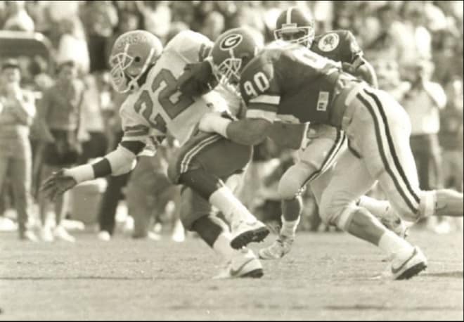 Jim Hickey drags down Florida’s Emmitt Smith in 1987.