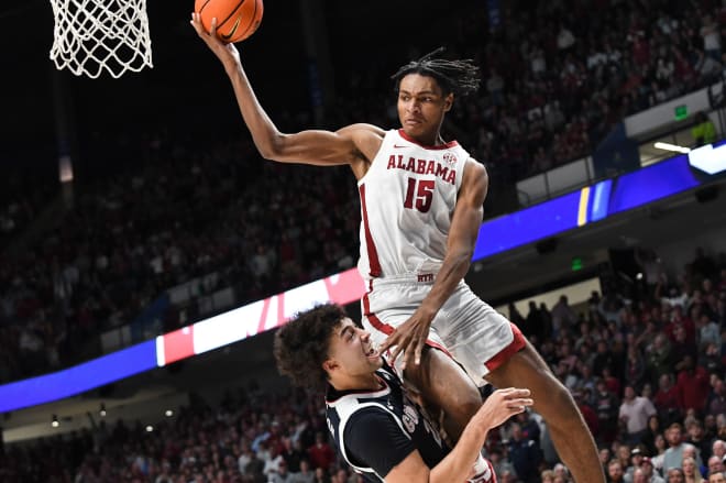 Gonzaga forward Anton Watson (22) undercuts Alabama forward Noah Clowney (15) as Clowney drives to the basket for a shot at Legacy Arena in the C.M. Newton Classic. Clowney was called for the offensive foul. Photo | Gary Cosby Jr. / USA TODAY NETWORK