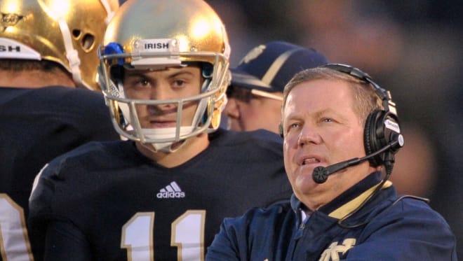 Notre Dame Fighting Irish football head coach Brian Kelly with Tommy Rees during his playing days