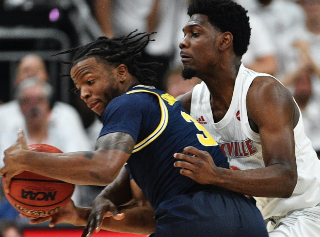 Louisville held Zavier Simpson in check in a 58-43 win Tuesday night. 