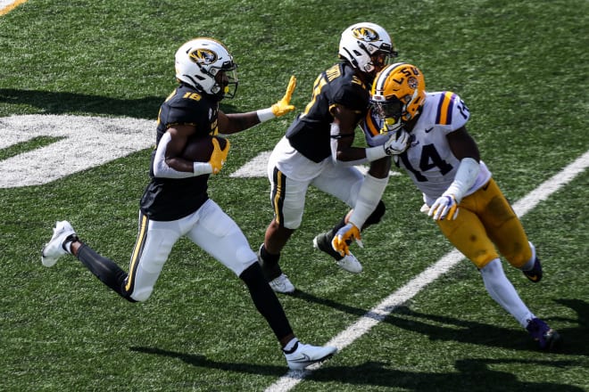 Walk-on receiver D'ionte Smith (31) caught six passes and threw a key block for freshman Chance Luper (18) in Missouri's upset of LSU.