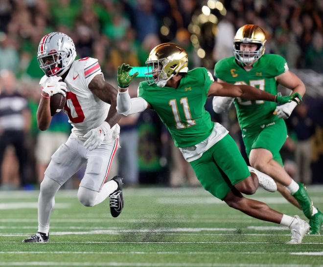 Notre Dame's Ramon Henderson, right, tries to make a play against Ohio State's Xavier Johnson during last weekend's game. 