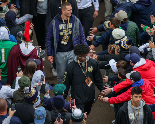 Wide receiver Cam Williams, middle, and quarterback CJ Carr, back, are two of Notre Dame's best 2024 class signees.