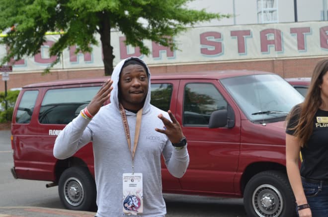 DB Jeremiah Criddell flashes a W to represent the West Coast during his visit to FSU.