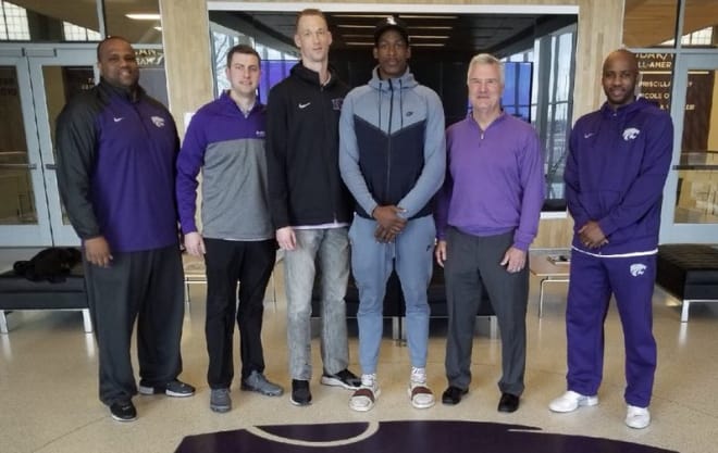 New commit Austin Trice poses for a picture with most of the Kansas State coaching staff.