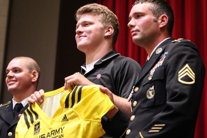 Four-star defensive end Aidan Hutchinson was all smiles while accepting his All-American jersey at Divine Child High School.
