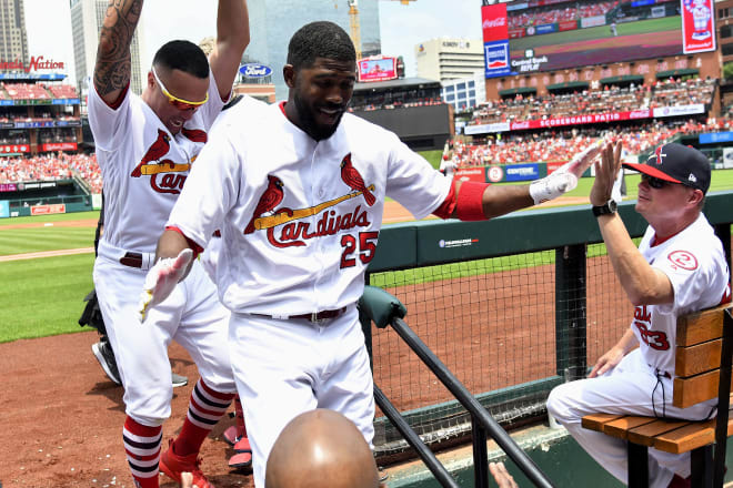 St. Louis Cardinals outfielder Dexter Fowler is congratulated after hitting a home run in July against the Cincinnati Reds.