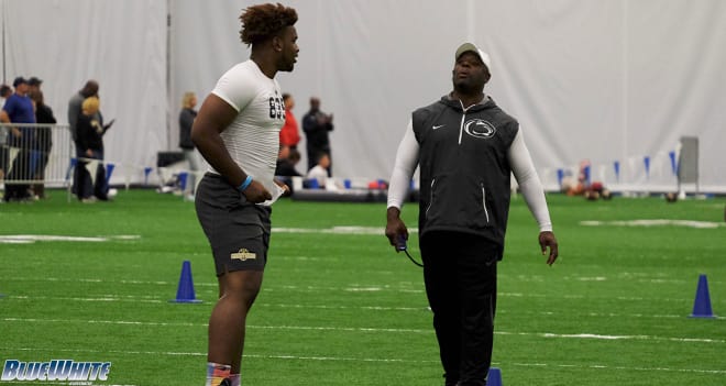 Hunte speaks with Sean Spencer during a camp in June.