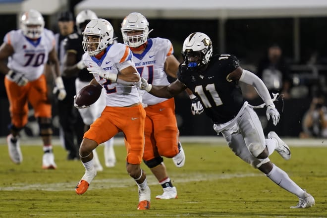 Boise State wide receiver Khalil Shakir (2) runs past Central Florida linebacker Jeremiah Jean-Baptiste (11) after a reception during the second half of an NCAA college football game early Friday, Sept. 3, 2021, in Orlando, Fla. (AP Photo/John Raoux)