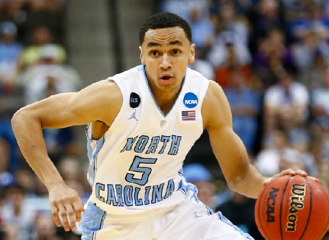 Marcus Paige and Hubert Davis arrived at UNC 12 years ago, they are together again, but in different roles.