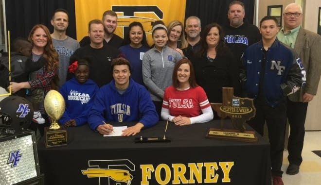 Luke Skipper, surrounded by family, signs with Tulsa
