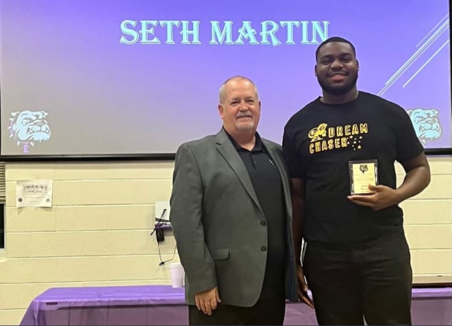 Dale Matlock with Seth Martin, the winner of Everman Football's 2021 Player of the Year award
