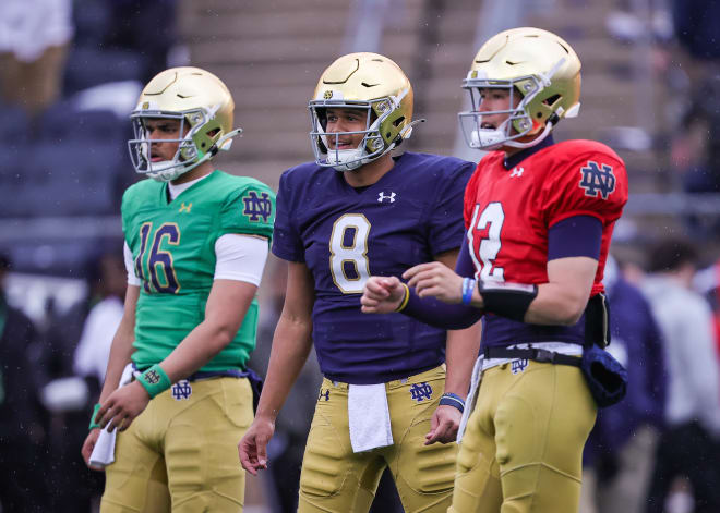 Quarterbacks Dylan Devezin (16), Kenny Minchey (8) and Tyler Buchner (12) warm up ahead of Saturday's Blue-Gold Game at Notre Dame Stadium.